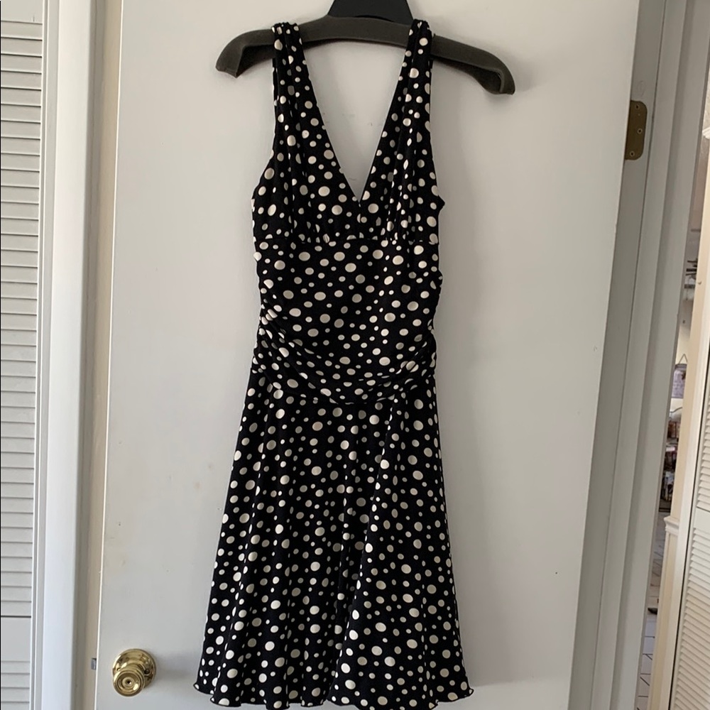 Black and white midi sundress with sleeveless halter neckline for cocktail